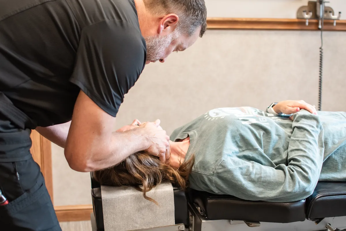 Hands-on chiropractic adjustment of the spine in Wooster