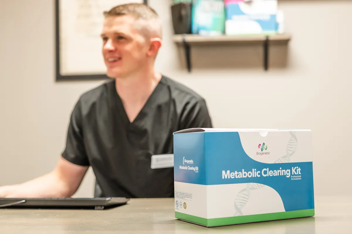 Dr. Aric Freischlag at his desk with a nutrition kit