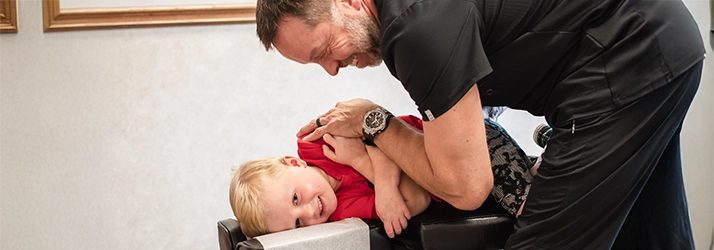 Chiropractor Wooster OH Dale Capela Adjusting Child
